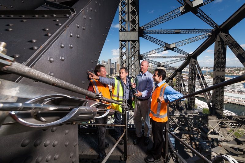 Four men inspecting Sydney Harbour Bridge