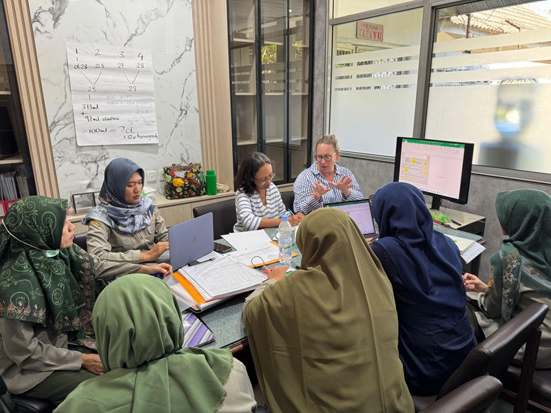 Dr Gemma Clark working with Indonesian colleagues
