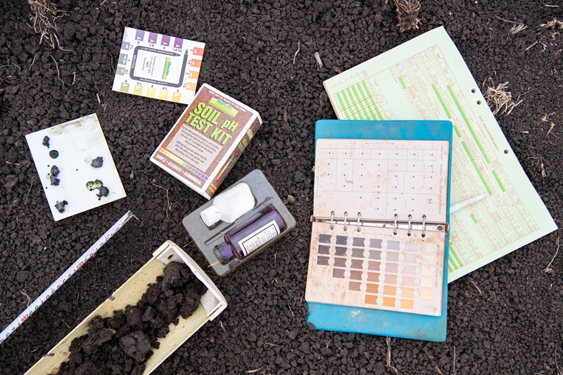 Different equipment, including testing kits and notebooks to test soils