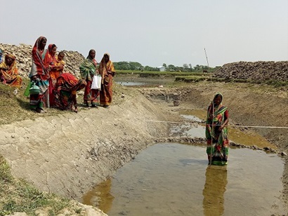 Women in Bangladesh building a canal
