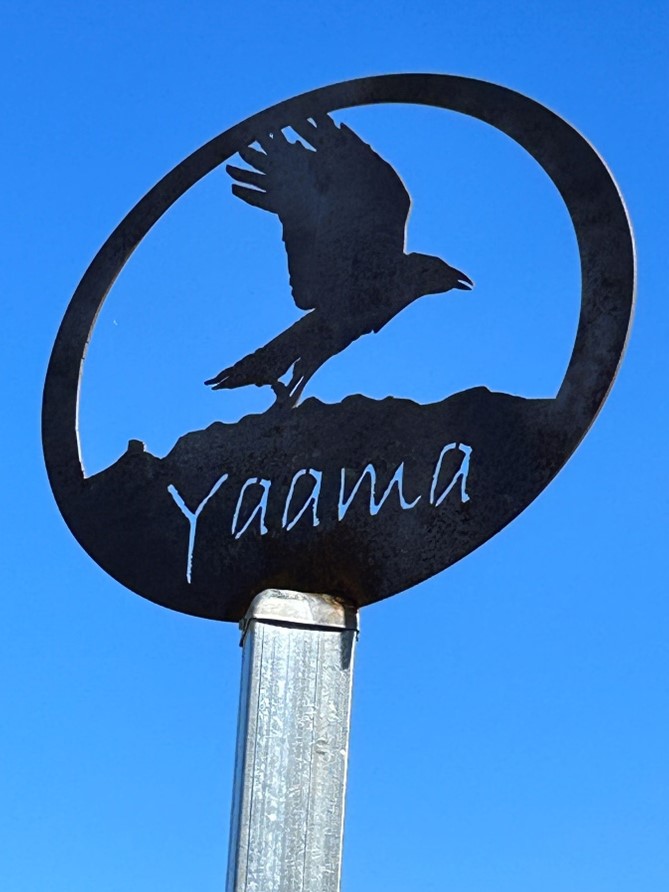 Yaama  sign against blue sky