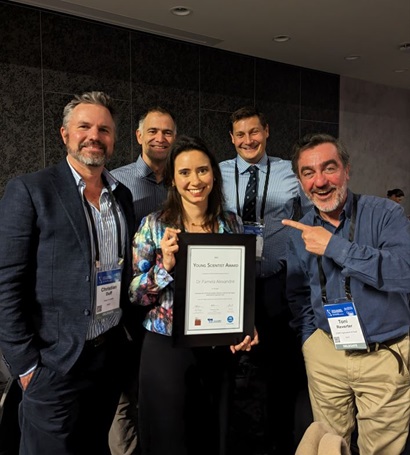 The Livestock Genomics Team pose with a certificate. 