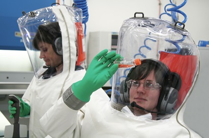 Scientists wearing fully encapsulated suits with their own air supply.