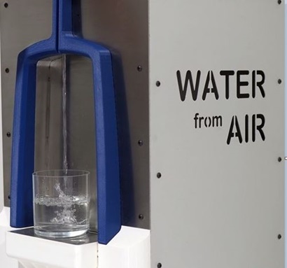 Atmospheric water generation prototype - picture of machine with 'water from air' written on the side and a cup of water sitting on the machine.