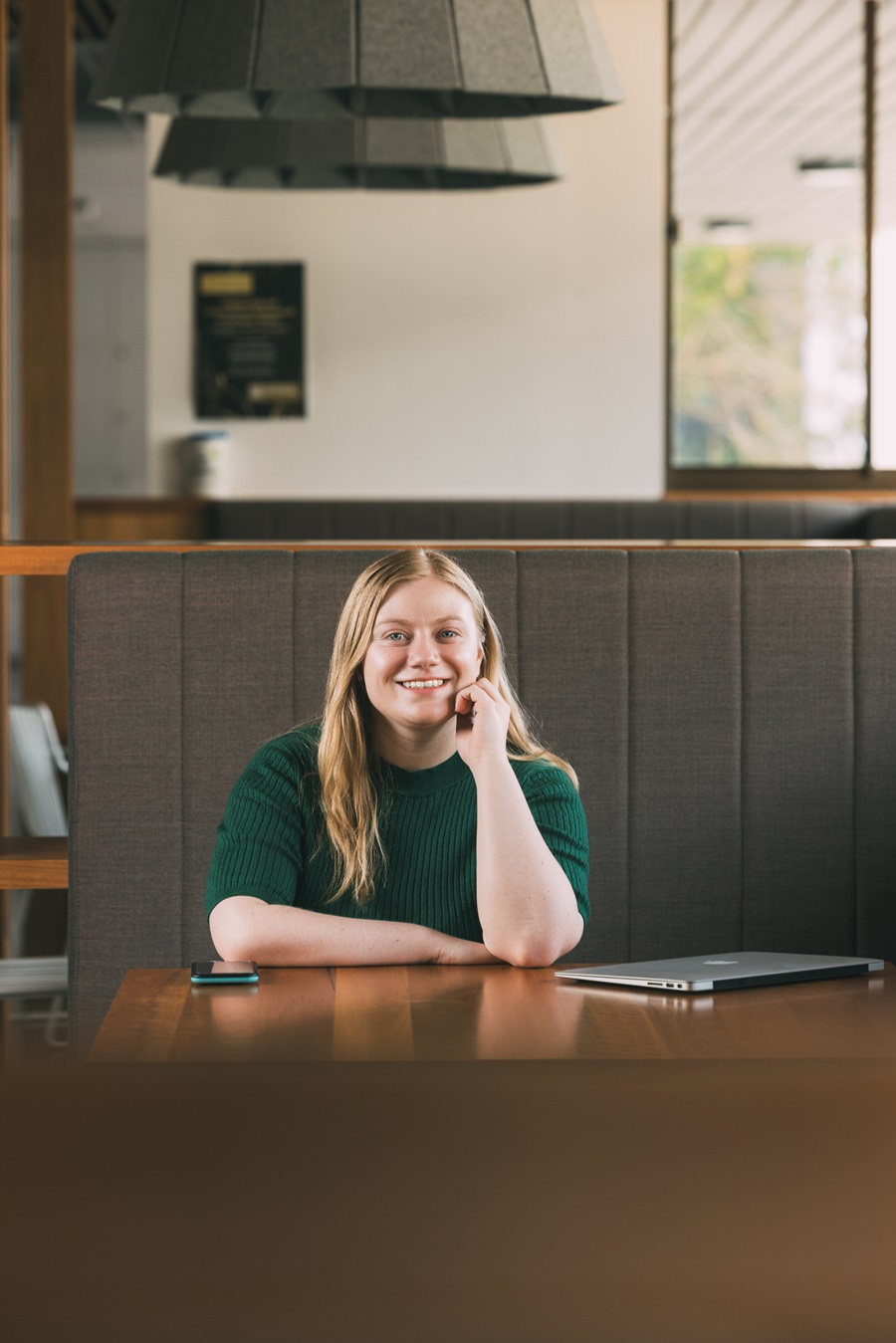 iPhD student Kristin Magarry sitting at a table 