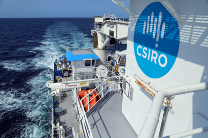 A boat with the CSIRO logo moving through the water