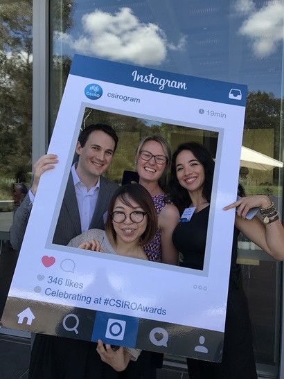 People posing in a fake instagram frame