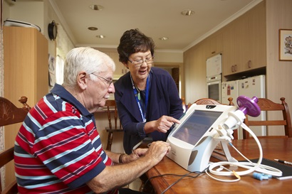 Patient and clinician using monitoring equipment