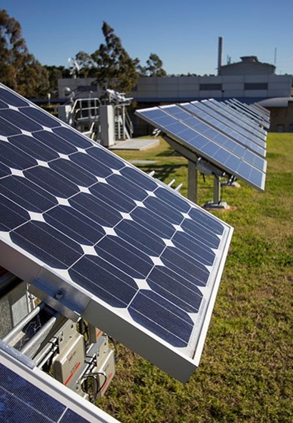 Image shows an array of solar panels. 