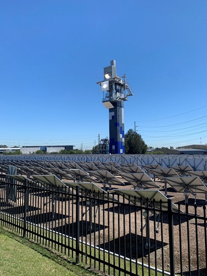 CSIRO's heliostat field with rectangular mirror panels reflecting sunlight onto a tower