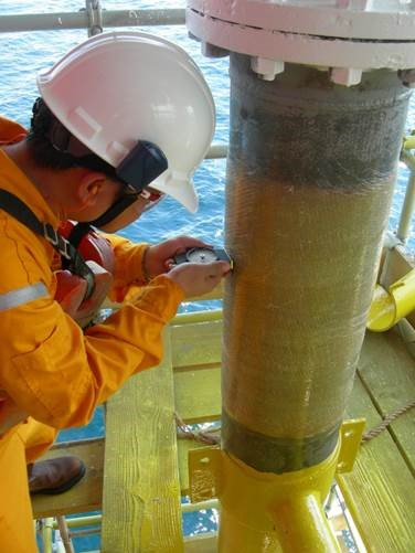 Man in safety gear working on PipeAssure equipment