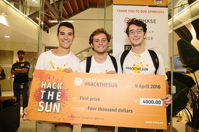 Thre young men, the winners of the CSIRO Solar Hackathon hold up their winning cheque