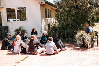 Students learn from Aunty Kerrie Saunders about traditional food and fibre—gaining insights into sustainable practices and cultural knowledge deeply rooted in Country