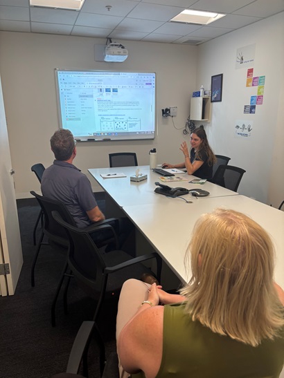 Olivia presenting her research to the management team at Council