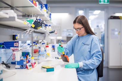 An image of a former UROP participant doing laboratory work
