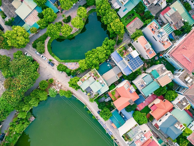 Aerial shot of buildings in Hanoi, Vietnam including rooftop solar panels. Image by Dwang Hong, Pexels