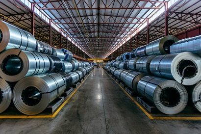 Rolls of galvanized steel sheet inside a factory or warehouse