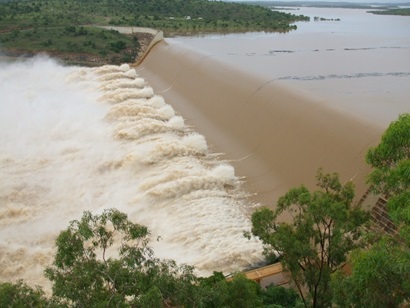 Water spilling over a dam spillway