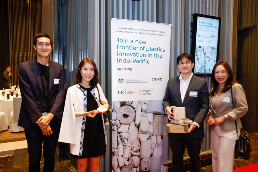 Four IPPIN program participants standing in front of a CSIRO banner at Thailand's Demo day event.