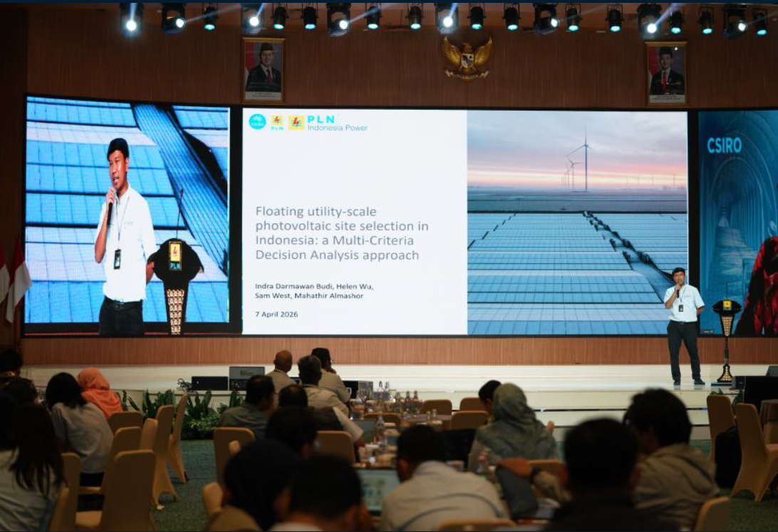 Presenter on stage at Indra 2025