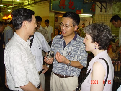 Four doctors in casual clothes having an informal discussion at a conference