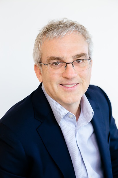 Profile photo of a man in a suit