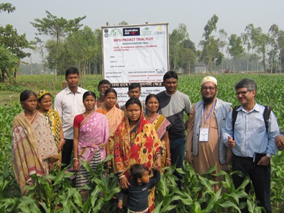 People in India standing in field of a farm for a photo of the SRFSI project