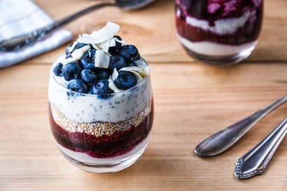 Chia pudding and blueberries in a round glass
