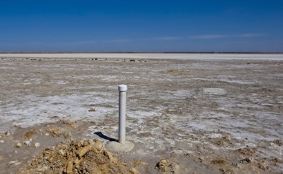 Barren landscape with salt visible on surface of soil