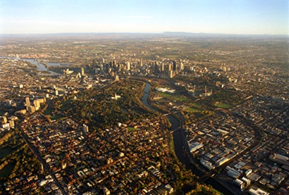 Aerial photo of Melbourne CBD, Yarra River, urban parkland and suburbs.