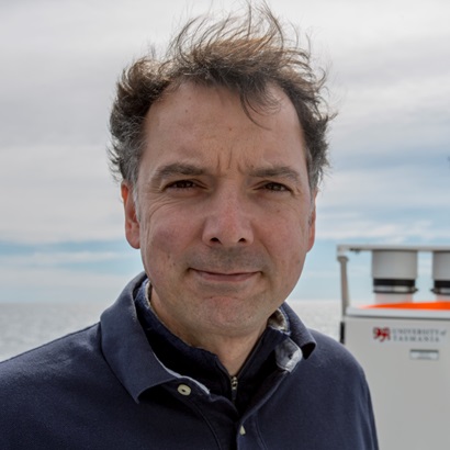 Profile picture of a man standing in an outdoor setting.