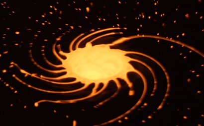 Close-up of molten steel showing spiral of glowing molten metal