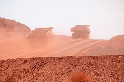 Trucks driving at iron ore mine