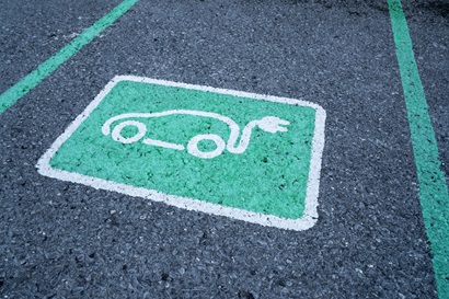 Electric vehicle sign on parking lot 