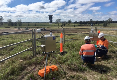 CSIRO researchers checking air quality monitoring equipment