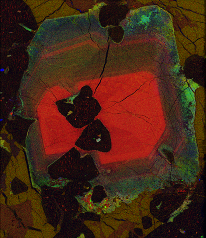 Magnified pyroxine grain showing pseudocoloured zone-patterns