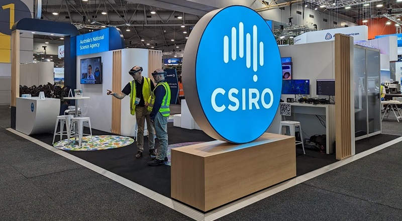 Large glowing CSIRO sign at front of CSIRO booth