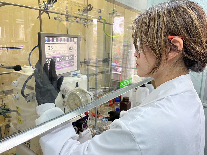 A scientist setting up an experiment