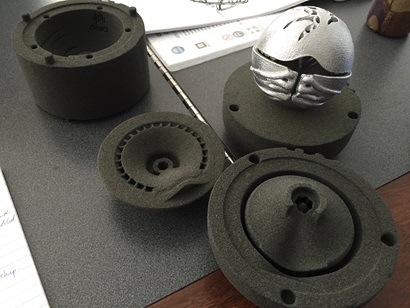 The CSIRO Ball sitting beside the 3D printed sand casting parts