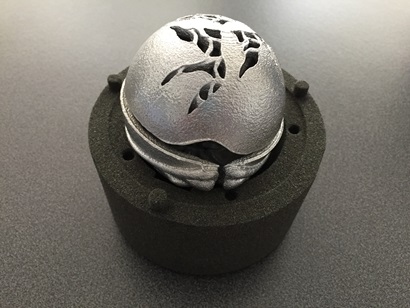 The CSIRO Ball sitting on top of the sand mould casting.
