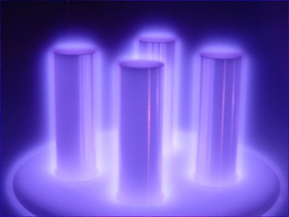 glowing purple verticle cylinders - covered in a plasma coating. 