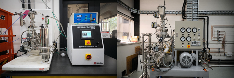 Various industrial machines with lots of tubes and switches and dials, in an industrial workshop setting.