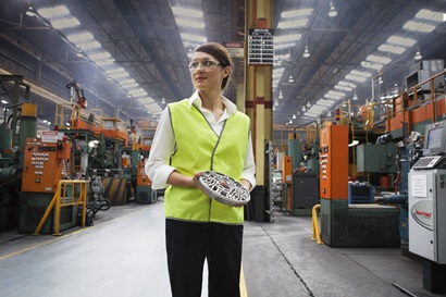 Nissan worker holding low pressure die casting part 