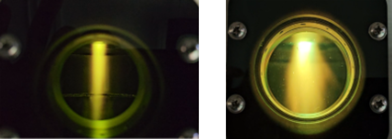 two images of a bright yellow plasma plume through a glass porthole in an industrial machine. In the first image the plume is quite narrow and contained, in the second image the plume is wider, brighter.
