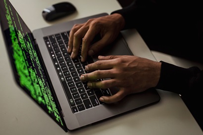 Hands on a laptop 