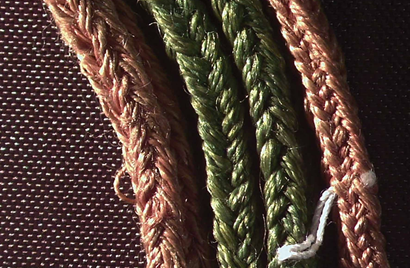 A close-up image of the finger-loop braiding of the silk cords from Australia's 1297 Inspeximus issue of the Magna Carta.