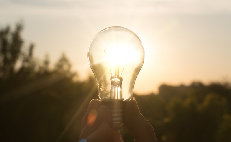 Lightbulb held to the sun 