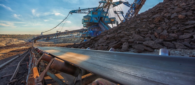 Conveyor belt moving rock