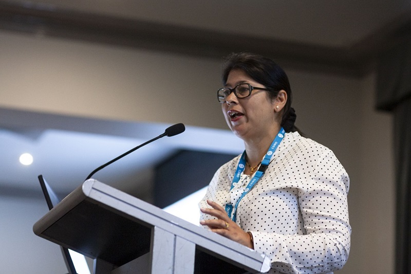 Close-up of Asmita Mahant from BHP standing at lectern delivering lecture