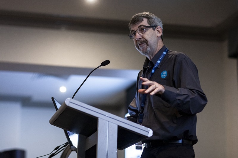 Bearded man standing at a lectern